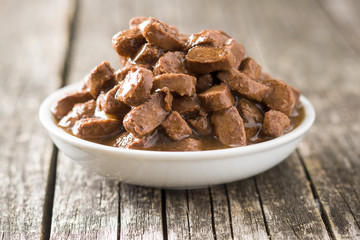 Meal for dog or cat. Canned meat with sauce.