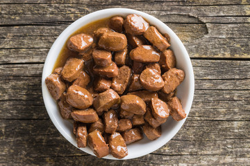 Meal for dog or cat. Canned meat with sauce.