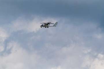 Fototapeta na wymiar Ultralight aircraft in the clouds
