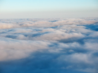 Top view over cloud cover in the mountains. Waves from the clouds.