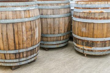 Fototapeta premium old traditional oversize wooden barrels for aging red pinot noir grapes for barrique wine