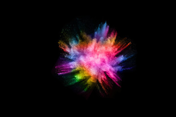 abstract colored dust explosion on a black background.abstract powder splatted background,Freeze...