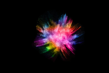 abstract colored dust explosion on a black background.abstract powder splatted background,Freeze motion of color powder exploding/throwing color powder, multicolored glitter texture.