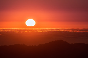 Red sunset over a sea of clouds as seen from the top of Mt Diablo, north San Francisco bay area, California