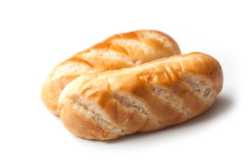 closeup of two milk breads on white background