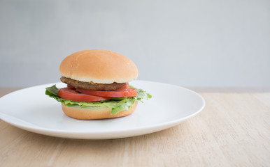 Closeup of Hamberger, It's junk food put on woodentable in food court