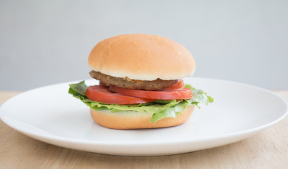 Closeup of Hamberger, It's junk food put on woodentable in food court
