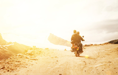 Obraz premium Motobike travelers ride on mountain pass road in indian Himalaya