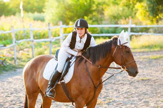 Girl equestrian rider riding a beautiful horse. Horse theme  