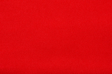 Red fabric material texture on blur background