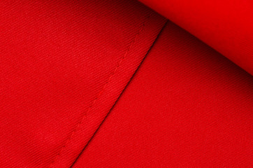 Red fabric material texture on blur background