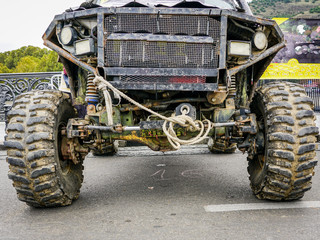 Fototapeta premium closeup front view of dirty black off-road car