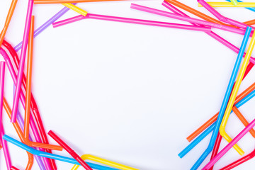 Top view plastic straws on white background with copy space for design, stop using plastics garbage for environment concept