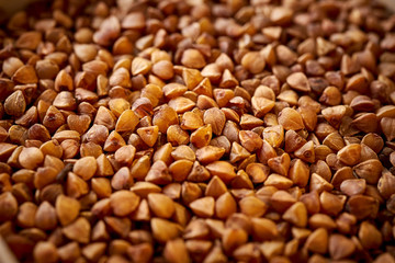 close up view on spilled brown buckwheat