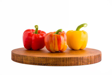 Three colorful sweet peppers on tray