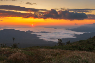 Beautiful sunrise over mist-covered valley