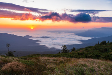 Beautiful sunrise over mist-covered valley