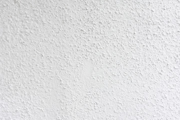 White gray painted cement wall, uneven concrete surface