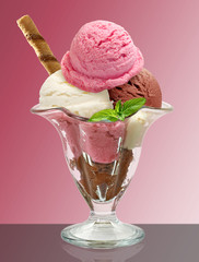 Vanilla, Strawberry and chocolate sundae ice cream cup and wafer isolated on pink background