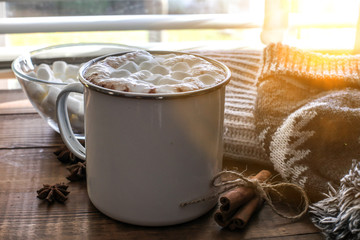 Hot chocolate with marshmallow on wooden table