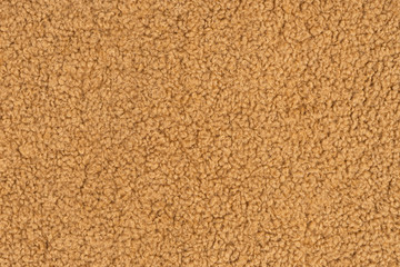 Fluffy yellow polyester texture background. Ecological material. View from above.