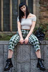 Stylish woman sitting on steps