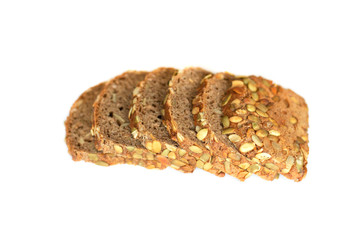 Healthy sliced bread with pumpkin seed isolated on a white background. Bread slices and crumbs viewed from above. Top view