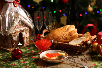 Fototapeta na wymiar bread with caviar, champagne and Christmas tree