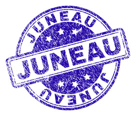 JUNEAU stamp seal imprint with distress texture. Designed with rounded rectangles and circles. Blue vector rubber print of JUNEAU tag with grunge texture.