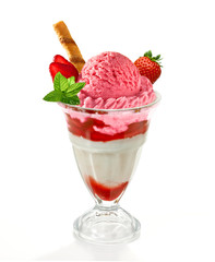 Strawberry and vanilla sundae ice cream cup with sauce and wafer isolated on white background