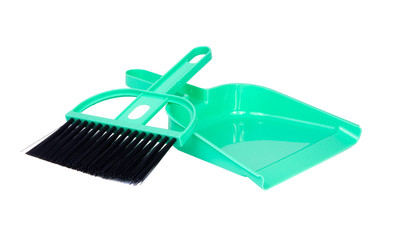 green dustpan scoop and brush isolated on the white