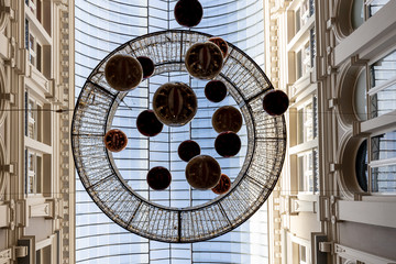 Horizontal straight up shot of decoration hanging from the ceiling of an indoor shopping passage
