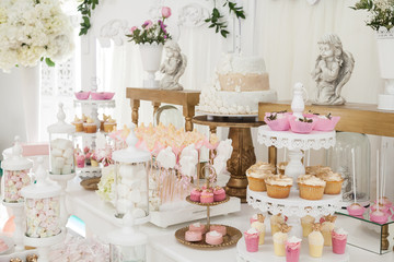 table with sweets decorated for children party reception
