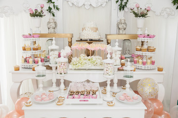 table with sweets decorated for children party reception