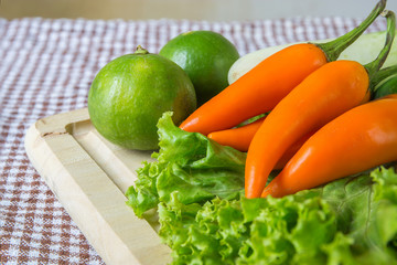 Fresh herbs and spices (chili, pepper, lettuce, lemon, cucumber)
