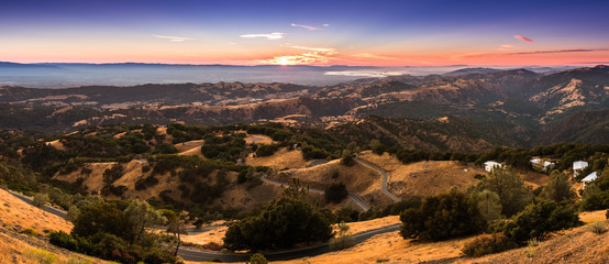 Sunset view of the surrounding hills and valleys from the top of Mount Hamilton, San Jose,...