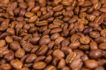 Background of many roasted coffee beans. Selective focus