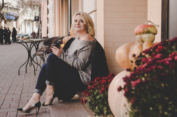 beautiful woman in black jacket drinking coffee