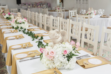 reception room decorated with tables and chairs for the party