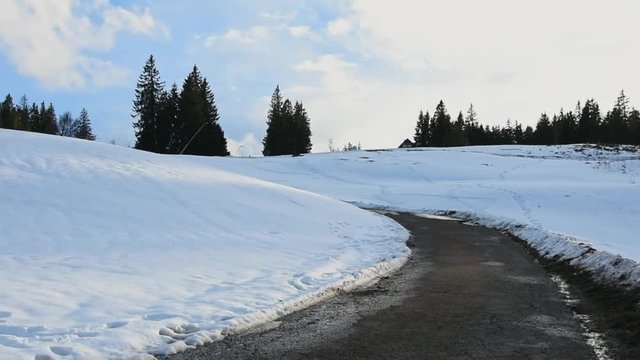 Panorama view of snow covered hill with hiking path in black forest, Germany.