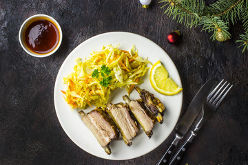 Smoked Roasted pork ribs on plate with cole slaw