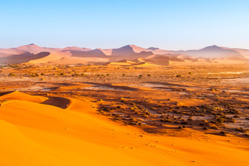 Naklejka na ściany i meble Red dunes of Namib Desert near Sossusvlei, aka Sossus Vlei, Namib-Naukluft National Park, Namibia, Africa.