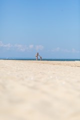 Mother and son spending time on sea shore