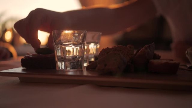 Glasses of water on a wooden table in restaurant.