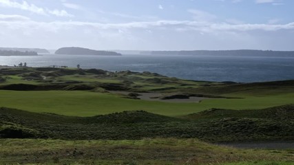 A sunny view of Chambers Bay Golf Course, Ketron Island, Anderson Island, and Puget Sound.