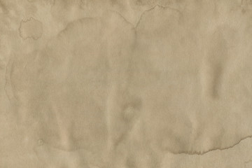 - Old coffee grunge paper texture. Vintage background for design and scrapbooking. Old, compressed and crumpled effect.