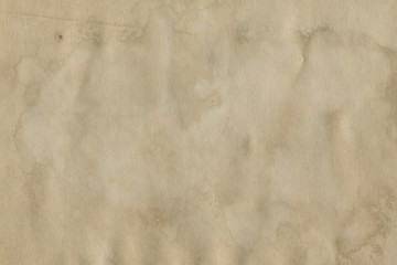 - Old coffee grunge paper texture. Vintage background for design and scrapbooking. Old, compressed and crumpled effect.