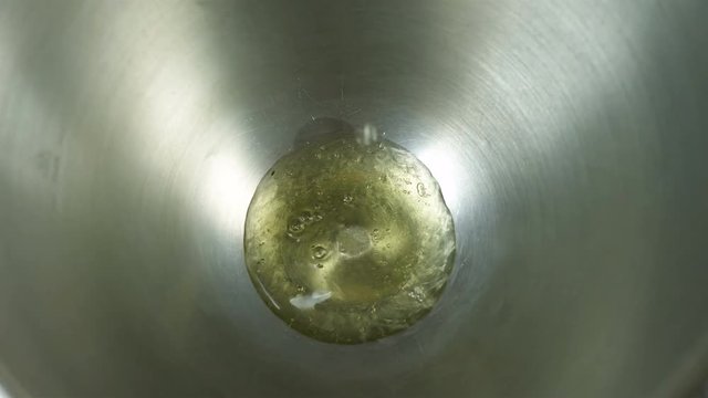 Proteins separated from egg yolks are poured into a container for whipping proteins, cooking in bize, macaroons