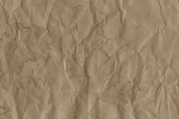 - Old coffee grunge paper texture. Vintage background for design and scrapbooking. Old, compressed and crumpled effect.