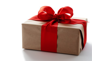 Gift box with red ribbon on white background